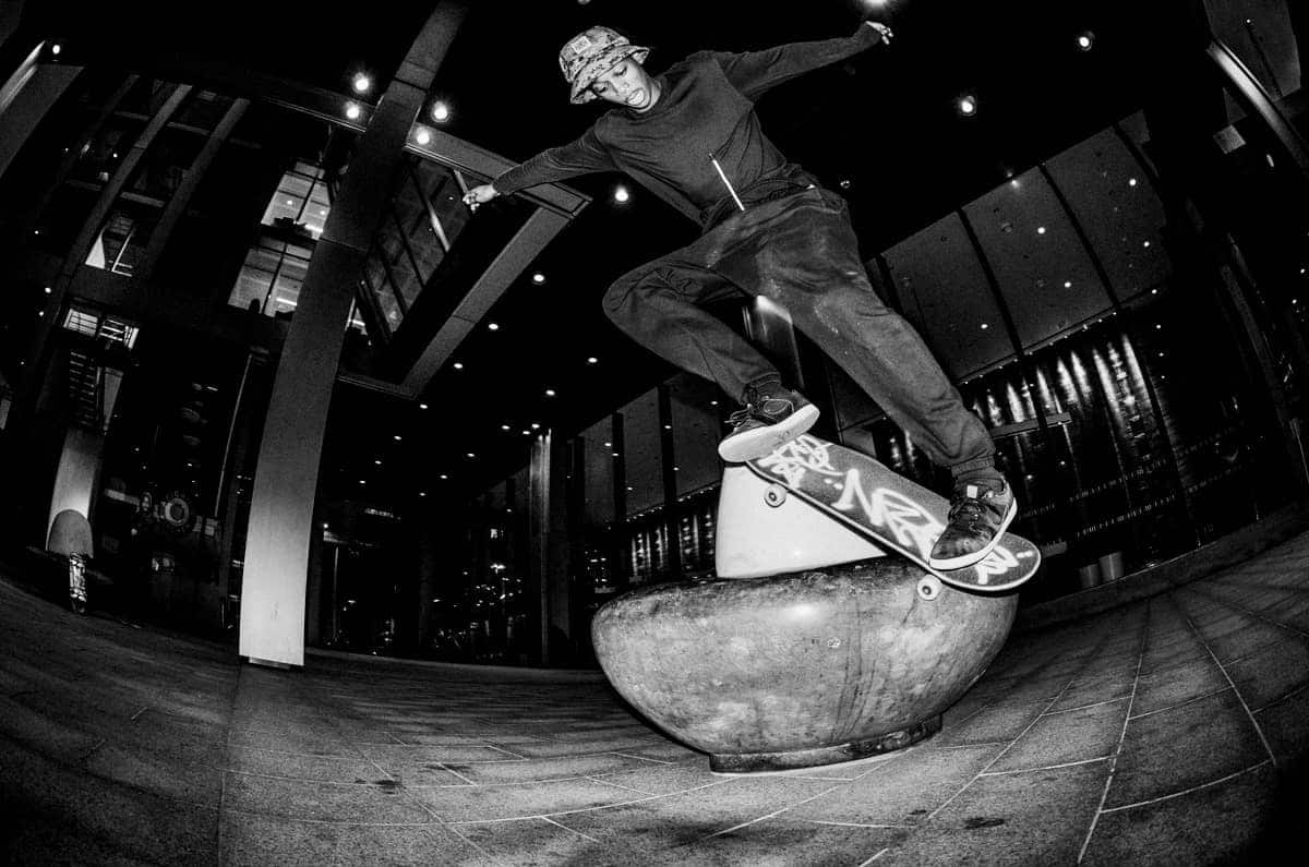 Kyle Wilson. Backside nosegrind revert in London. Shot by Chris Morgan using flash and a 10.5mm lens.